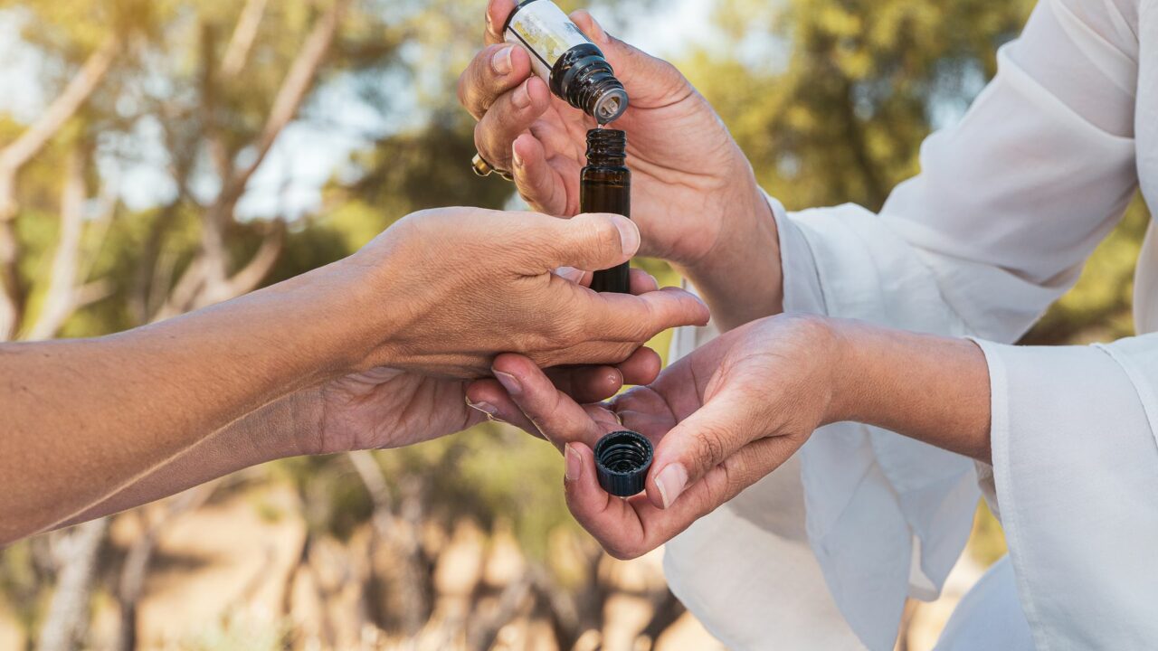 women testing aromatherpy oils on a summertime mindfulness ritual.