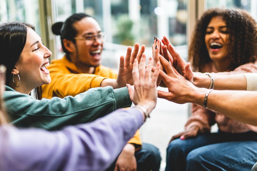 Multiracial happy young people stacking hands-Group of diverse f