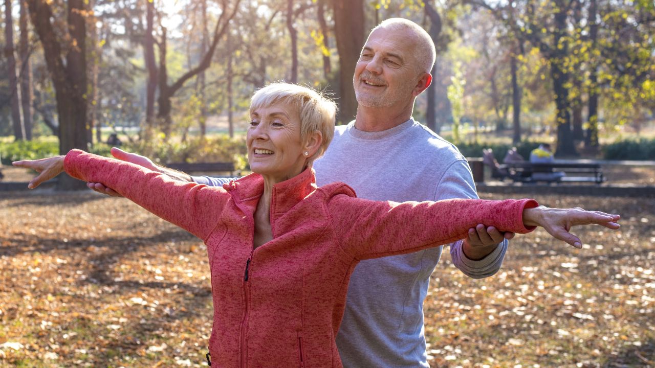 happy-elder-couple-exercising-park happy-elder-couple-exercising-park