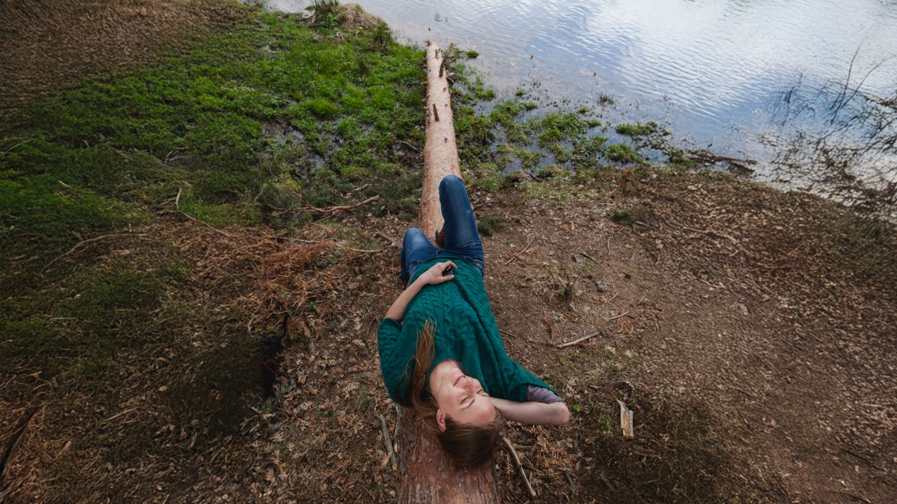 relaxed-girl-lying-log relaxed-girl-lying-log